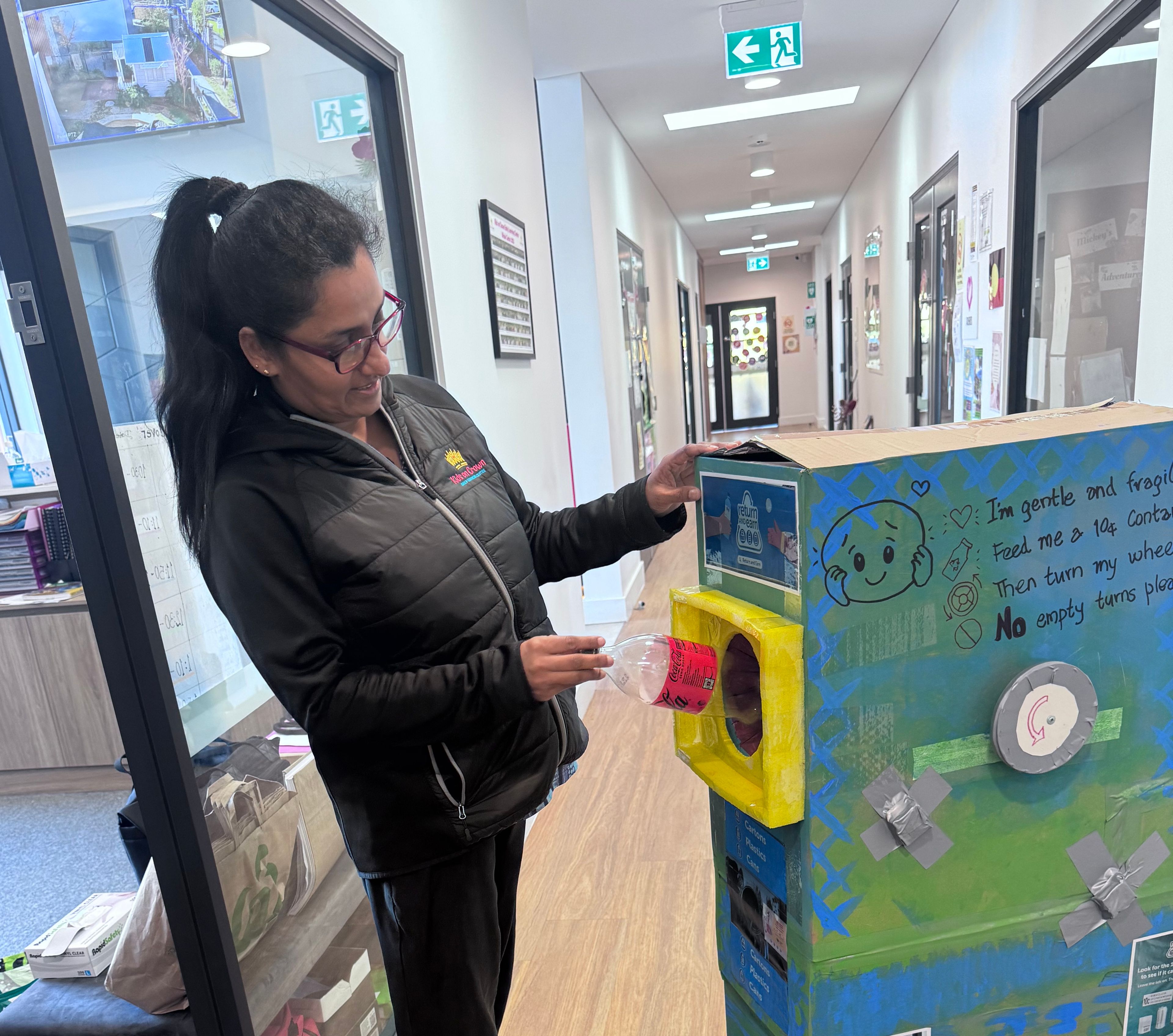 Educator Miss Sashi using their unique bin