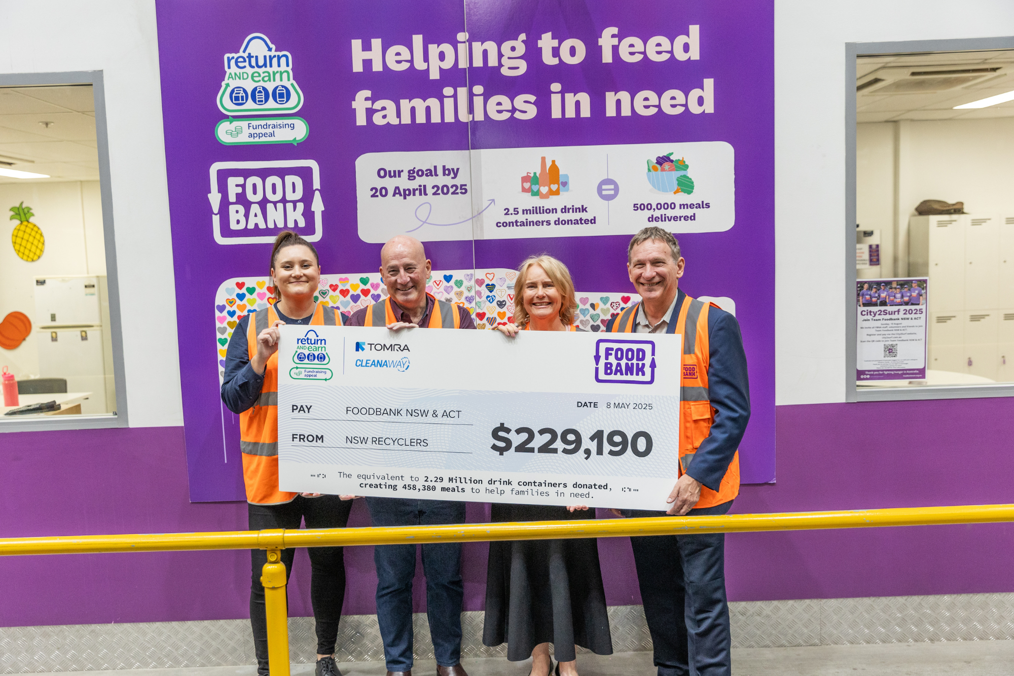 Return and Earn handing over giant check for $229,190 to Foodbank NSW & ACT, following the conclusion of their fundraising appeal with Return and Earn.