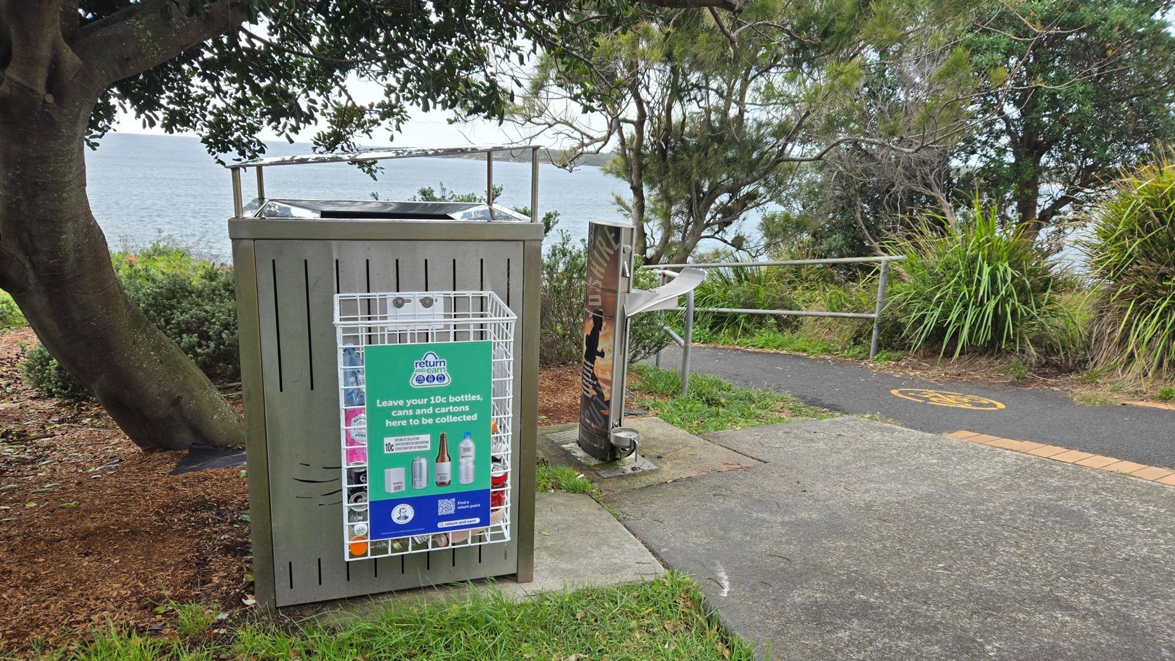 our bin basket placed beside a pathway