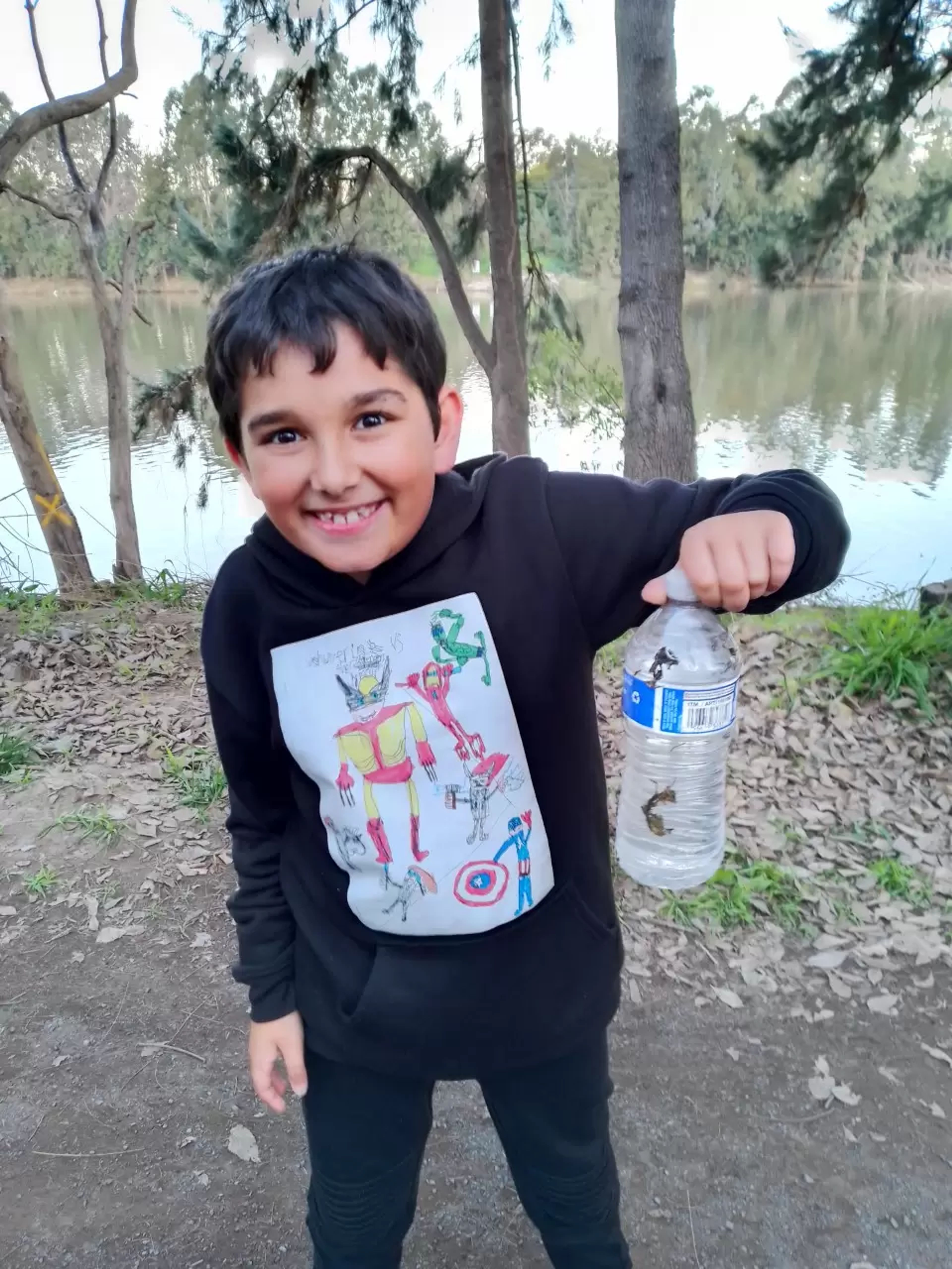 Kid holding a bottle