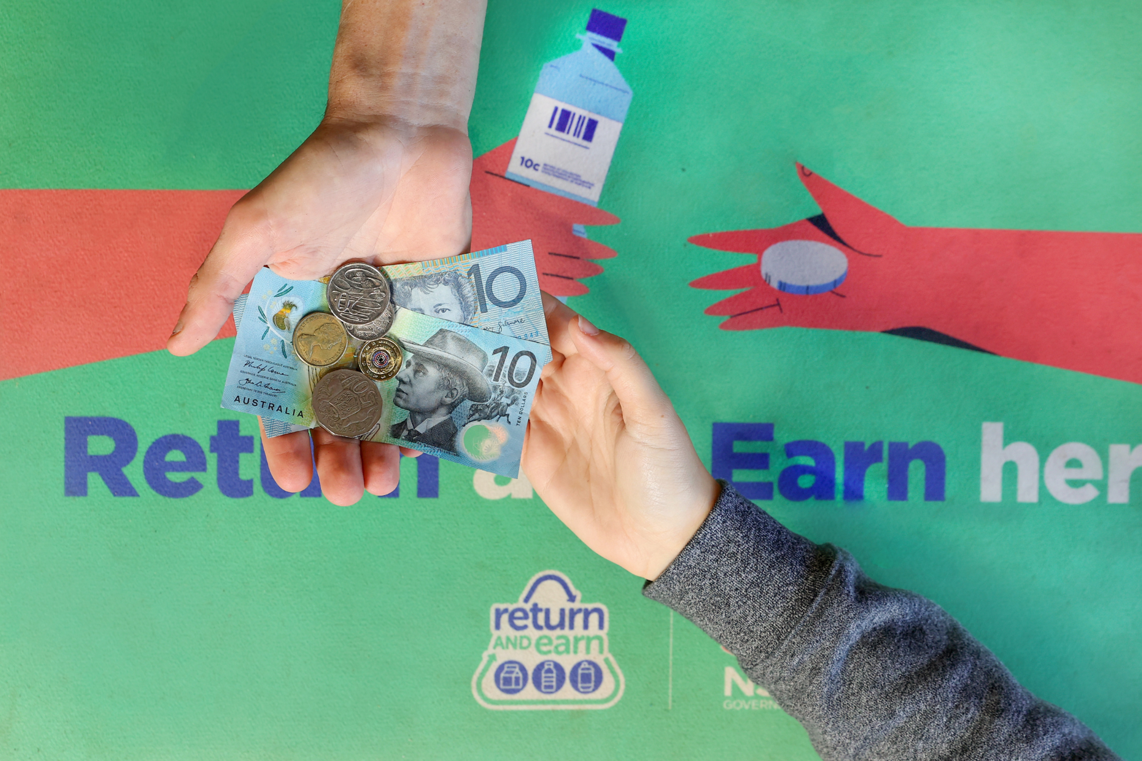 An image of a child holding a receipt from using Return & Earn 