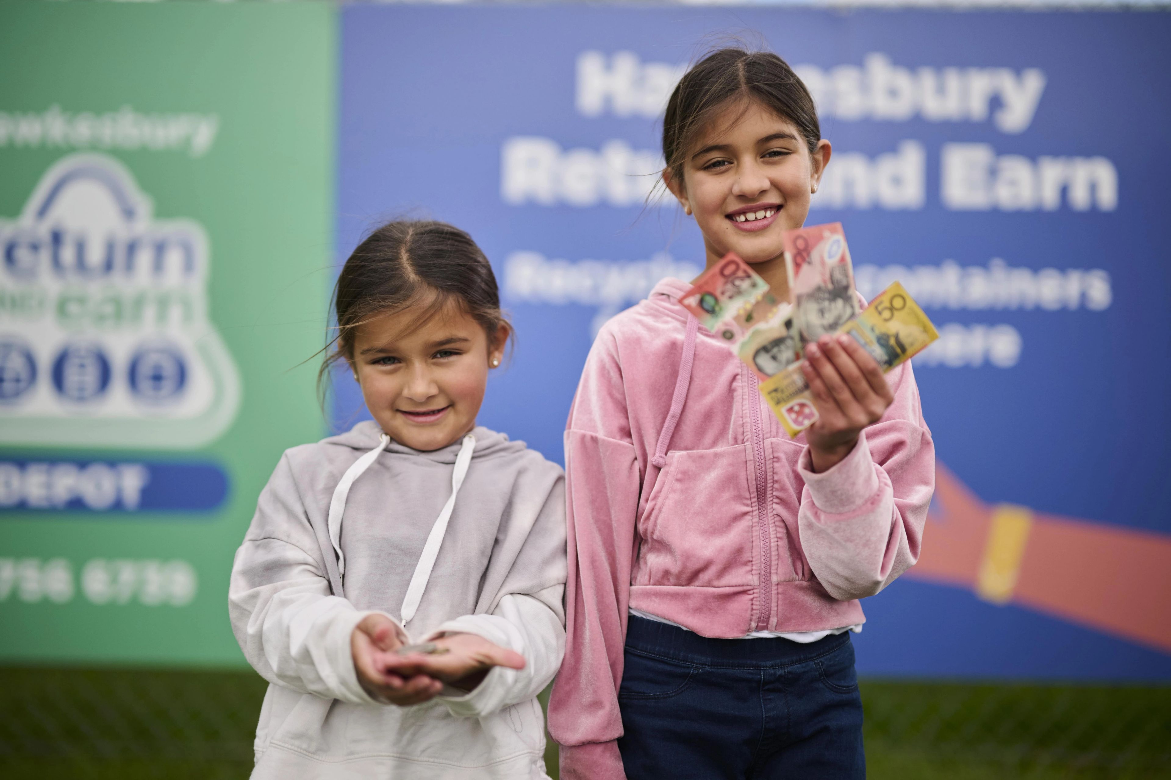 Kids holding money for return and earn