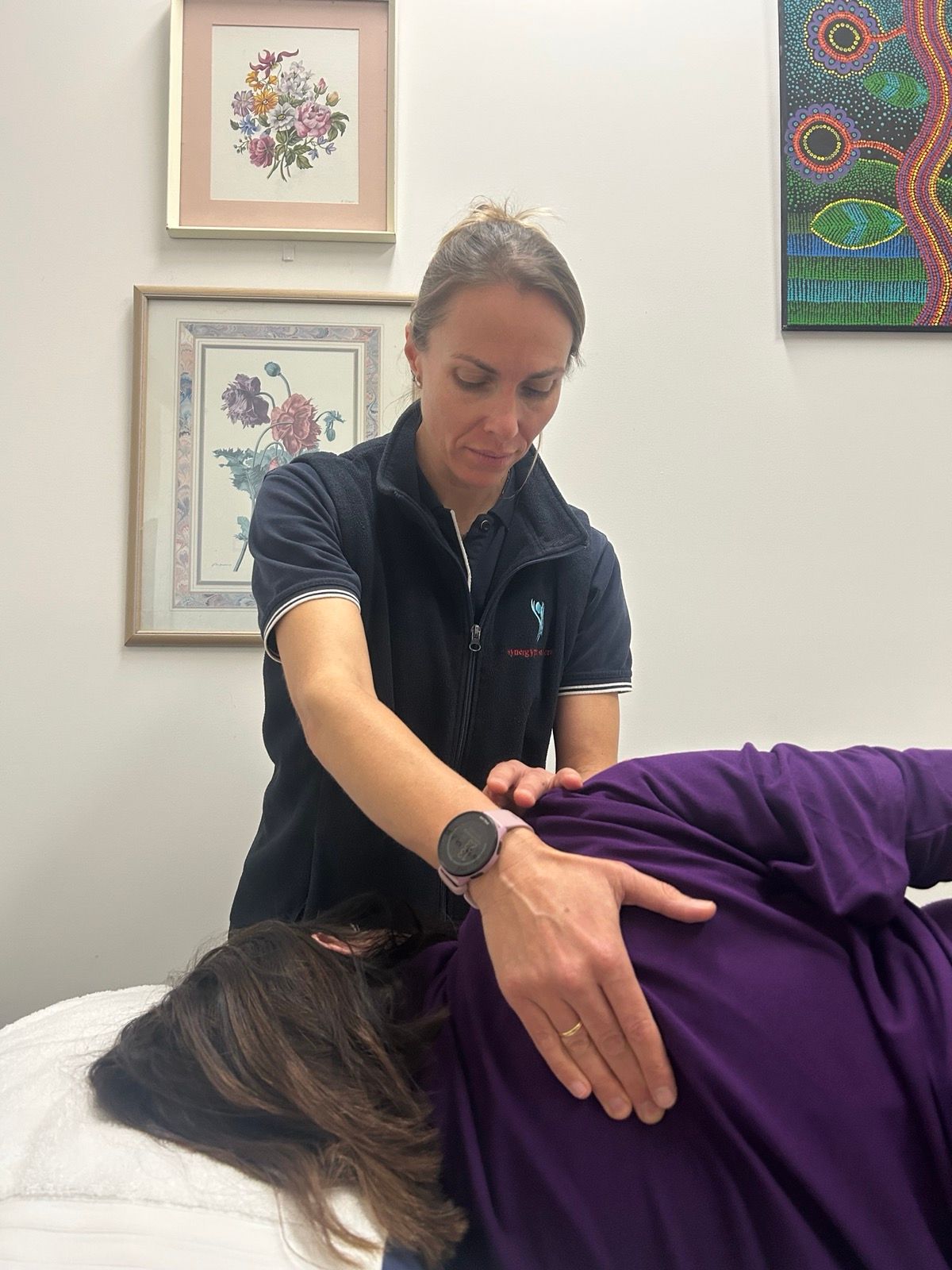 Treating a patient (physio)