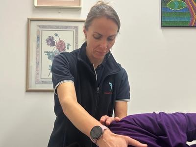 Treating a patient (physio)