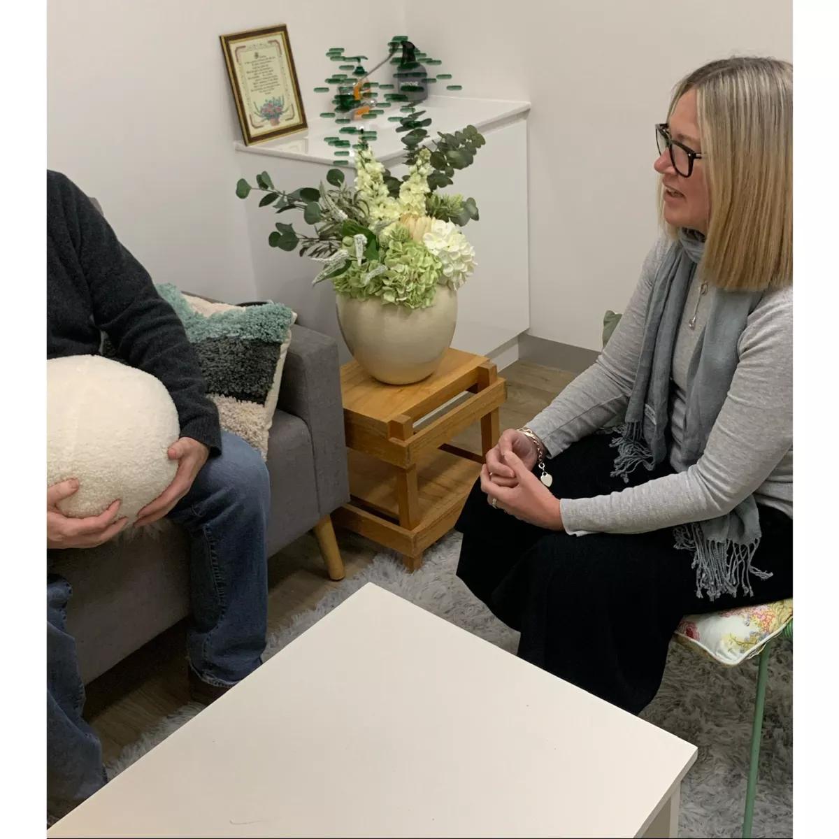 Sarah talking to someone at the clinic