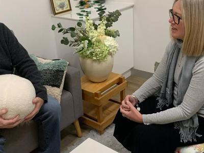 Sarah talking to someone at the clinic