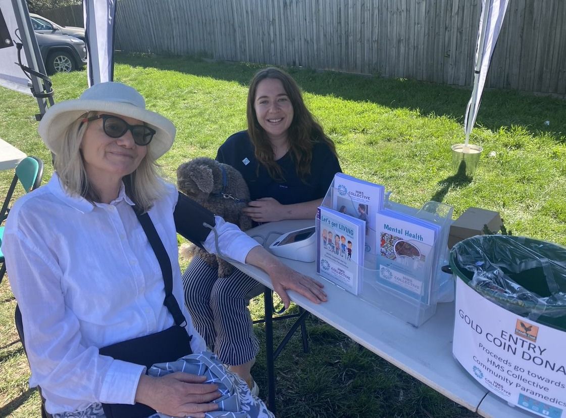 people at market doing a blood pressure