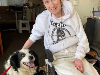 female with dog in wheel chair