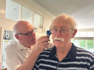 person getting an ear check