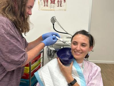 person doing an ear washout