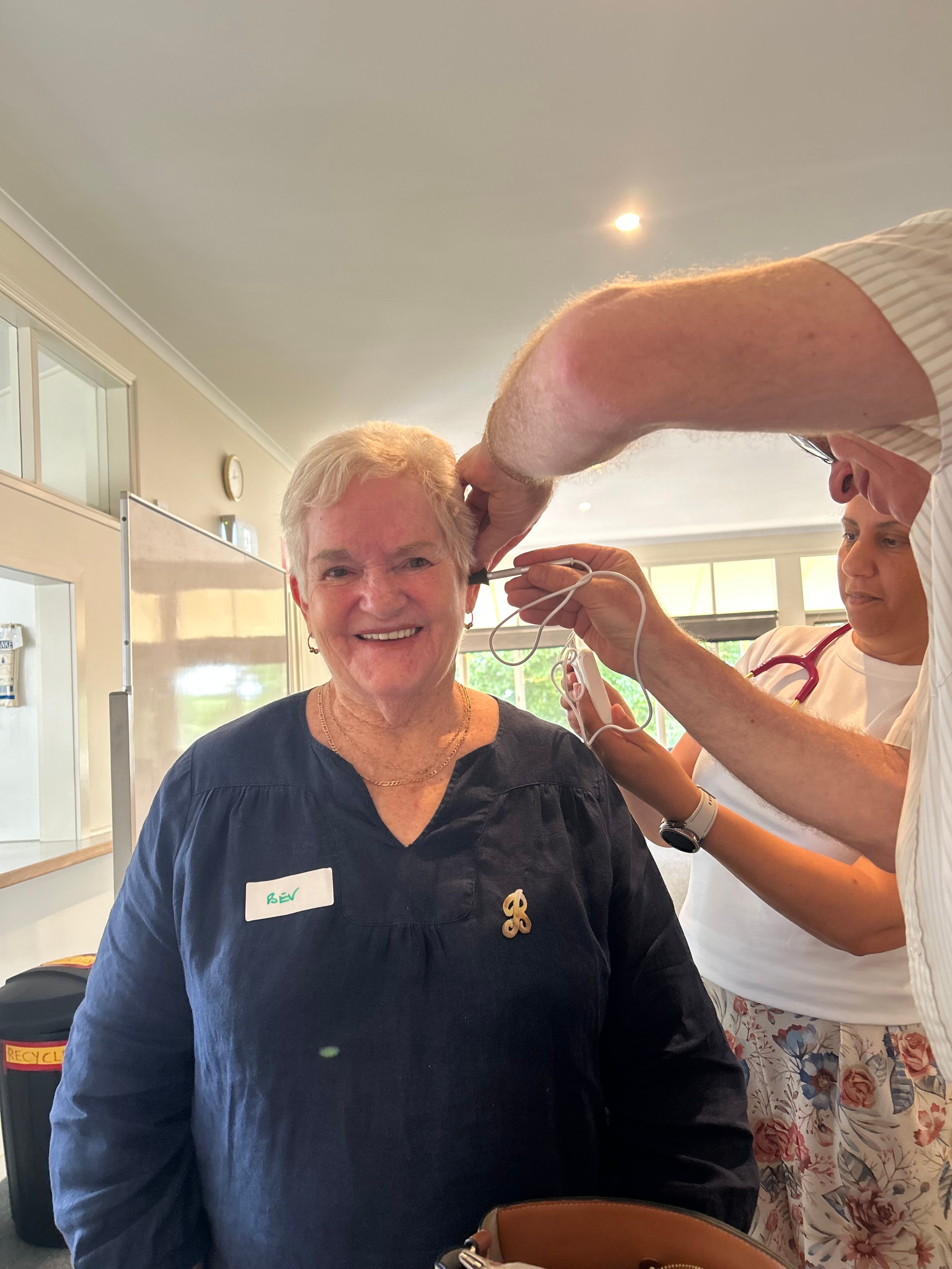 person getting their ears checked