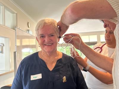 person getting their ears checked