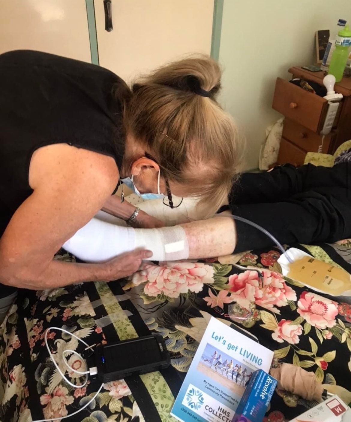 person getting dressing changed