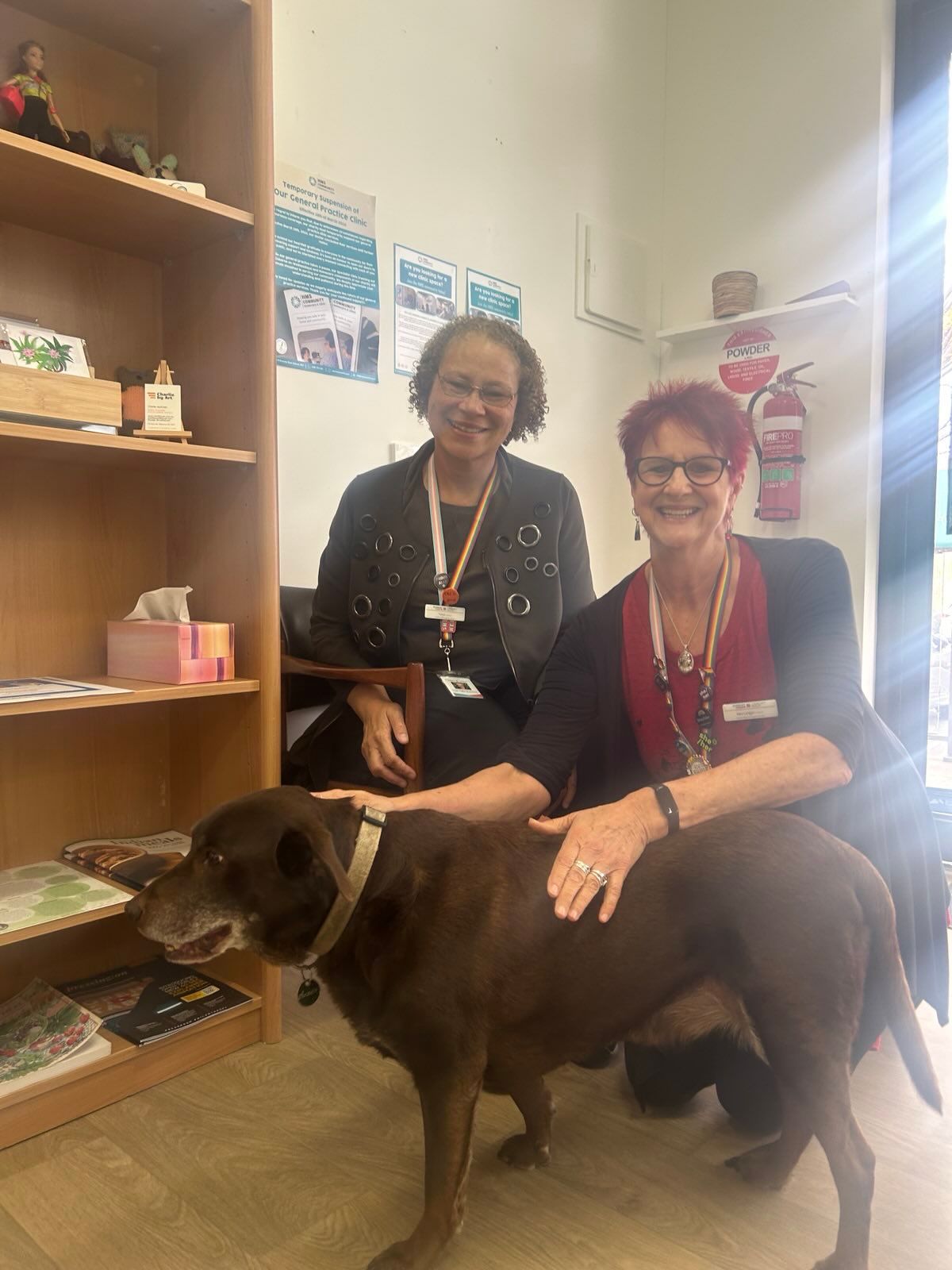 two people with a dog