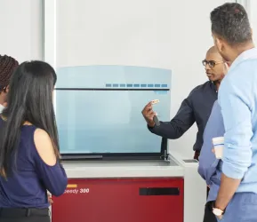 A diverse group of founders collaborating in a modern workspace.
