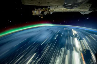 Illustration of the International Space Station orbiting Earth, representing the Orbital Edge Accelerator.