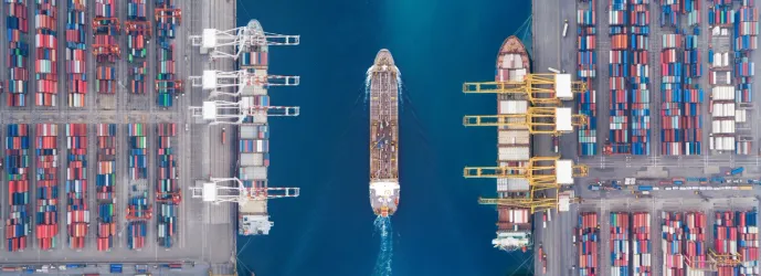 A modern cargo ship sailing on the open sea, symbolizing maritime innovation.