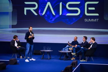 Founders pitching on the main stage at the RAISE the STAKES AI competition.