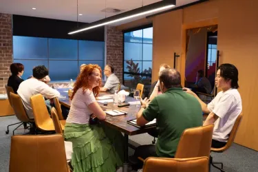 A group of diverse founders collaborating during a Blackbird Giants mentoring session.