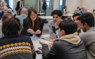 A diverse group of entrepreneurs collaborating at the Helsinki Incubators Journeys program.