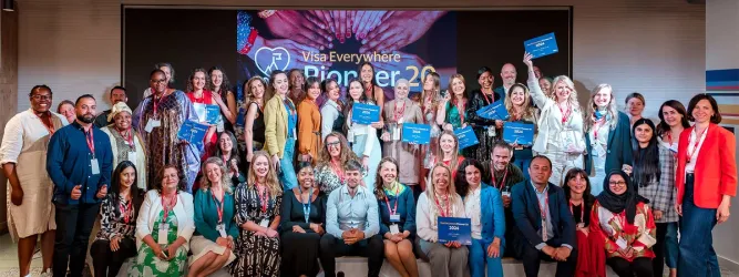 Diverse group of entrepreneurial women with refugee backgrounds collaborating.