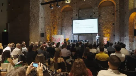 University auditorium with students and researchers at a HiTech programme information session.