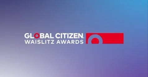Three diverse award winners standing together at the Global Citizen Waislitz Awards ceremony.