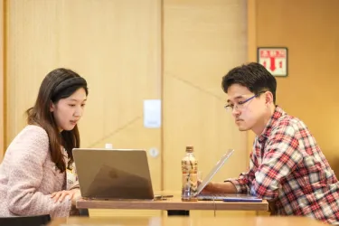 A group of diverse startup founders collaborating during a Google for Startups event.
