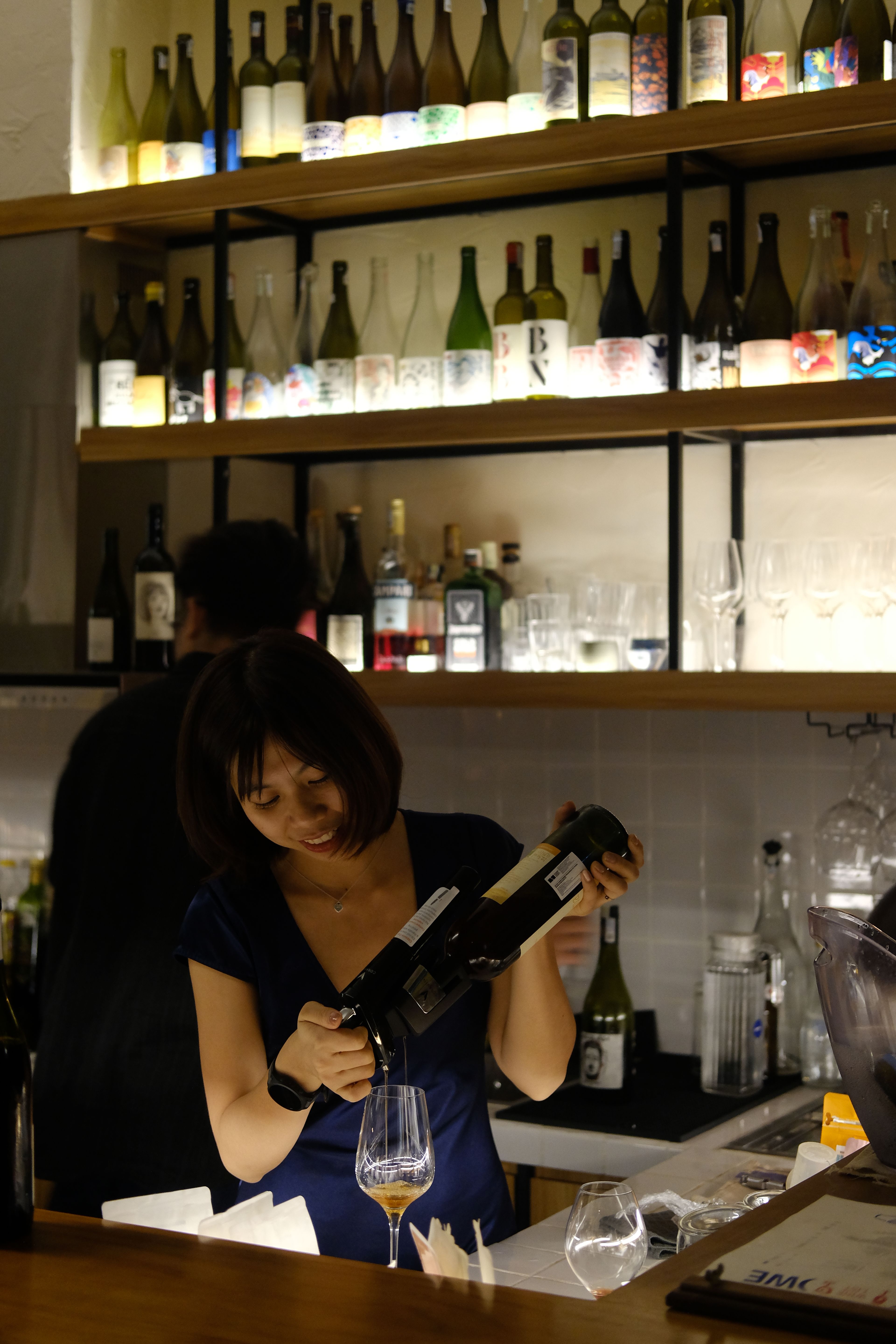 lady pouring wine