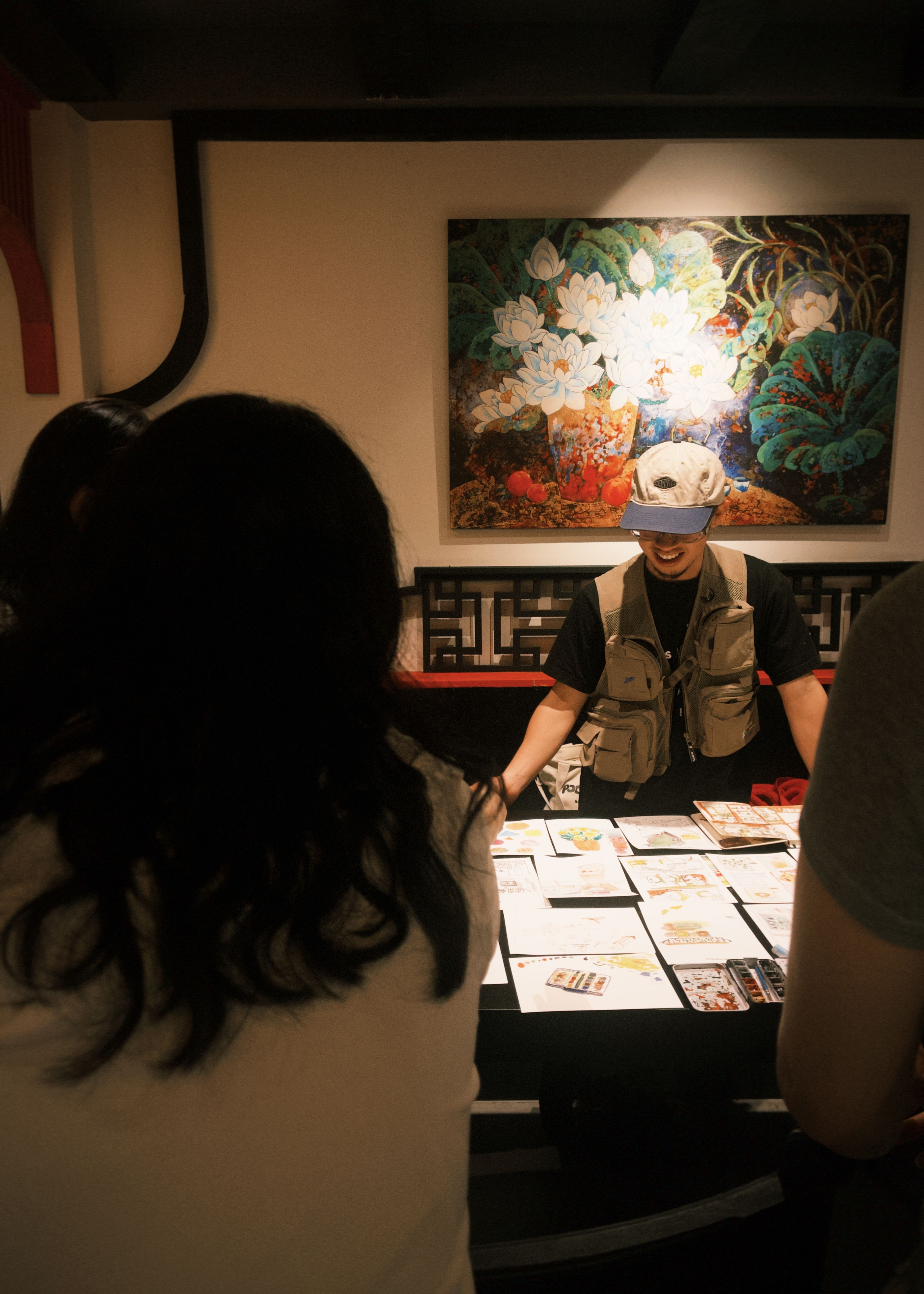 guy with art on table 