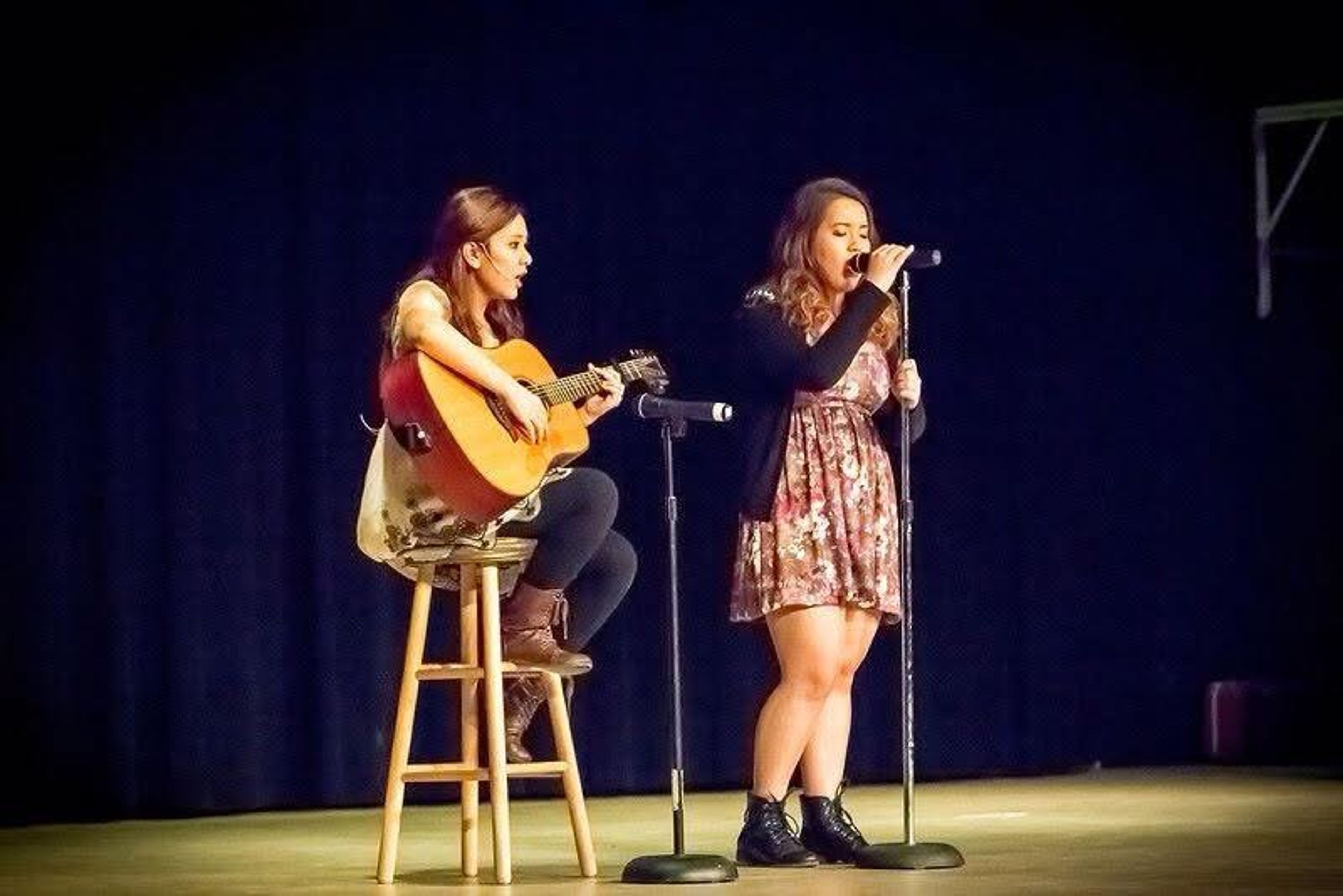 Van playing guitar at a school talent show