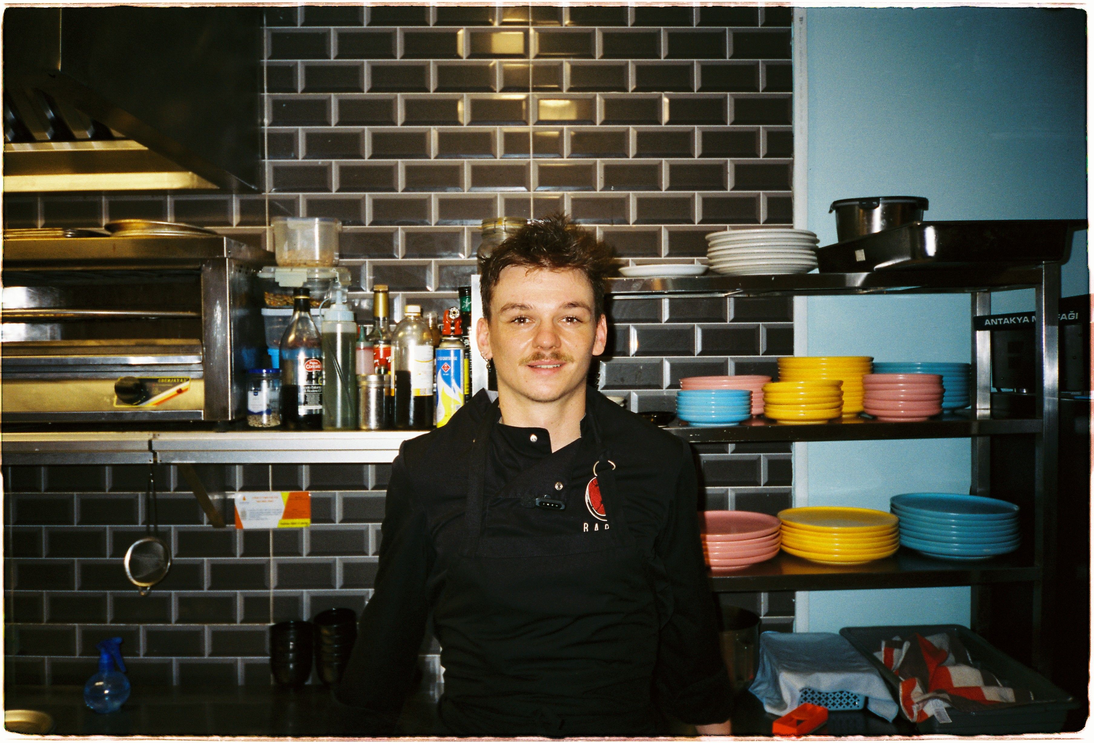 chef standing in kitchen 