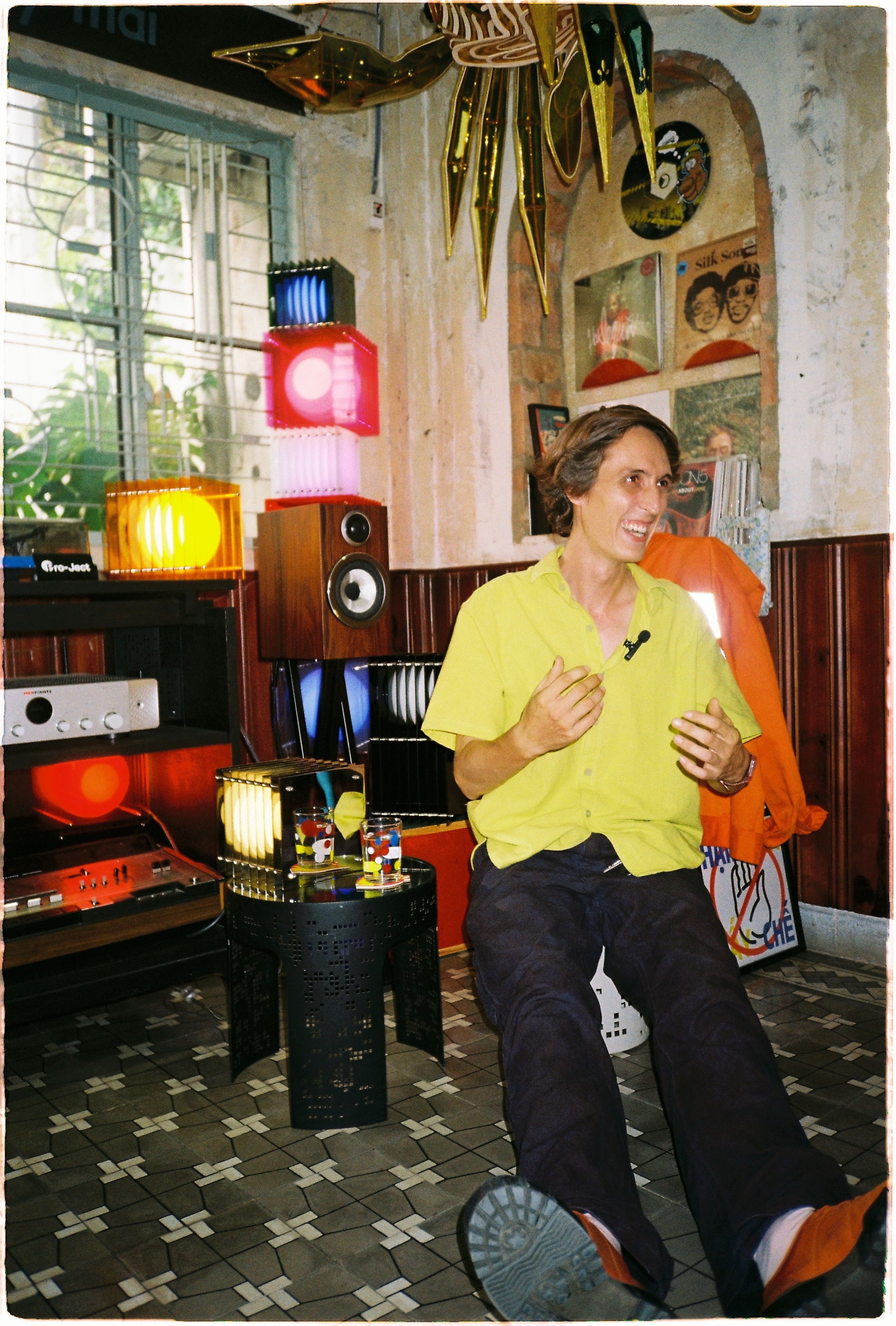 thomas sitting next to bang lights at neo