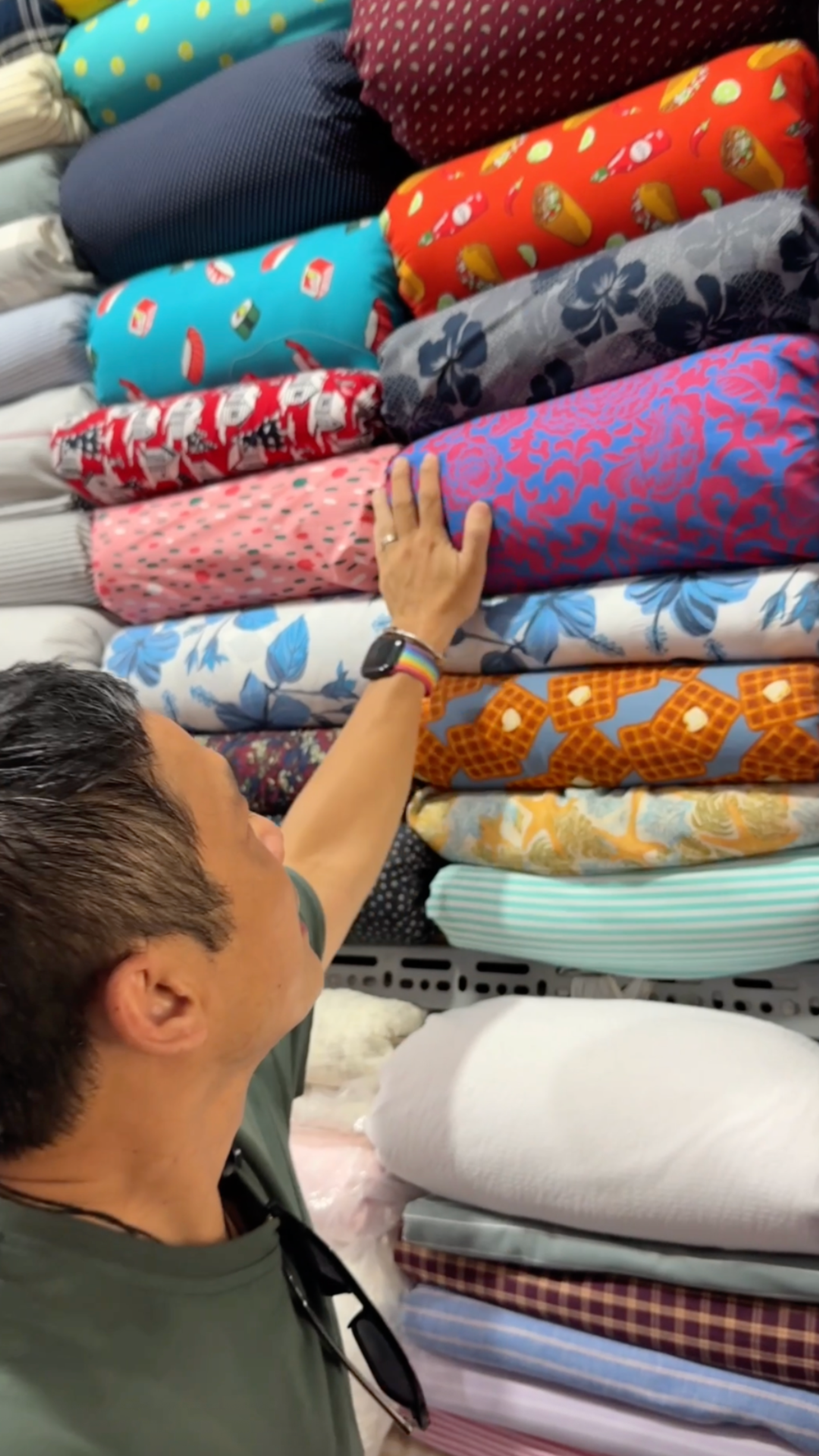 Lam searching through deadstock fabrics