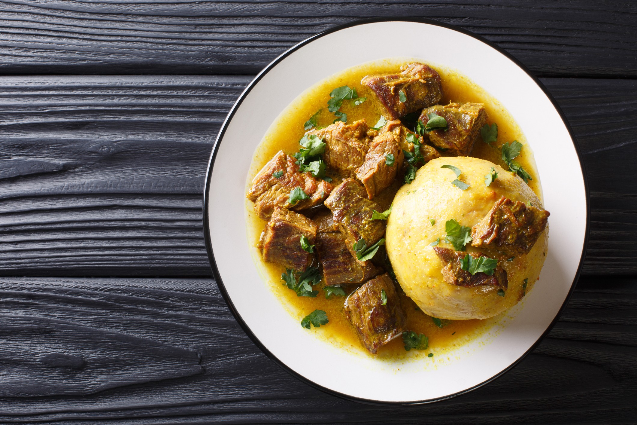 In Puerto Rico, Mofongo, which incorporates plantains, garlic and chicharron served with meat and broth, is influenced by African cultures./Getty