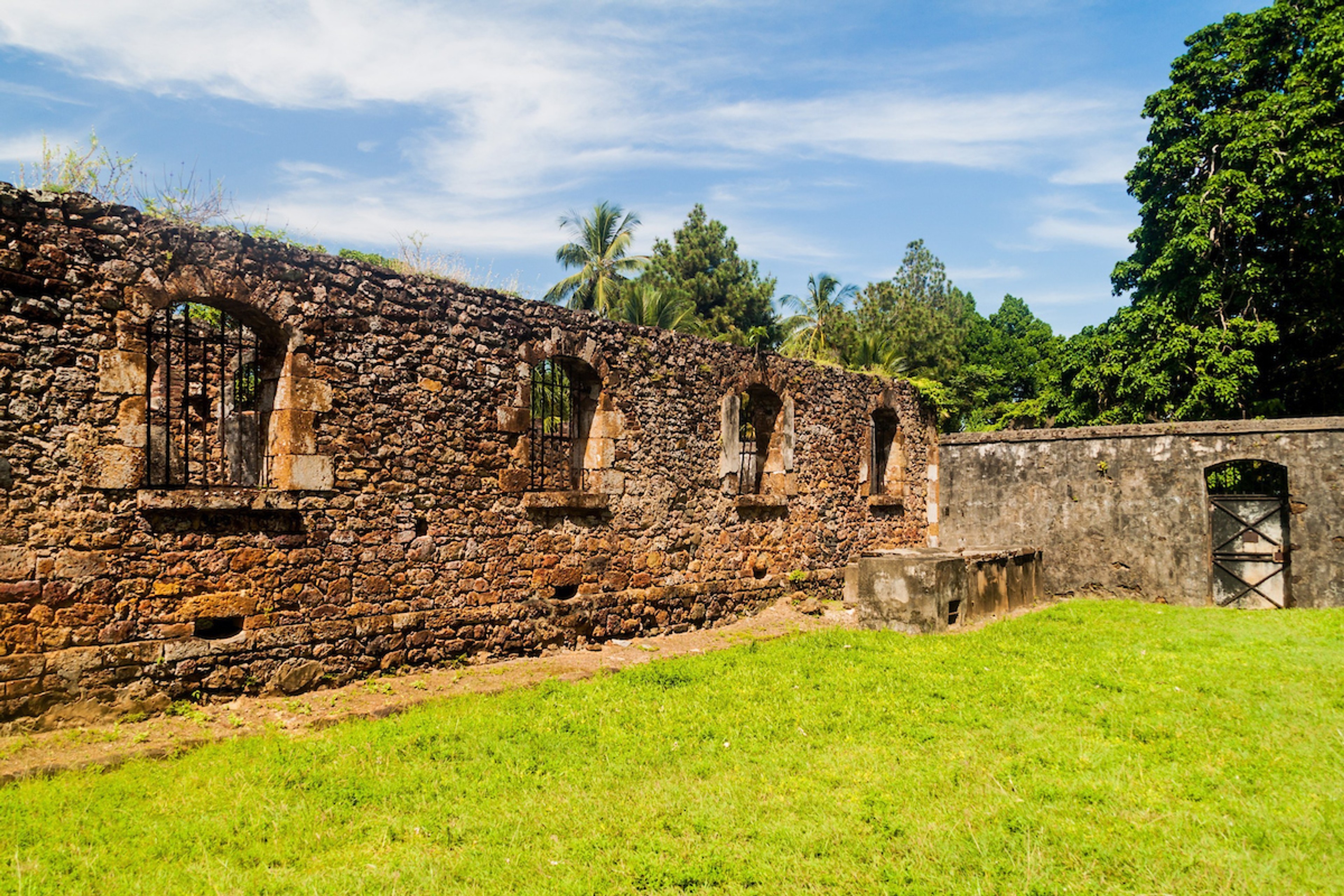Ruins of former penal colony at Ile Royale, one of the islands of Iles du Salut (Islands of Salvation) in French Guiana/ Shutterstock