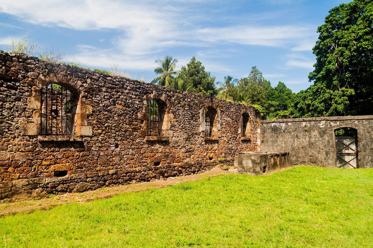 Ruins of former penal colony at Ile Royale, one of the islands of Iles du Salut (Islands of Salvation) in French Guiana/ Shutterstock