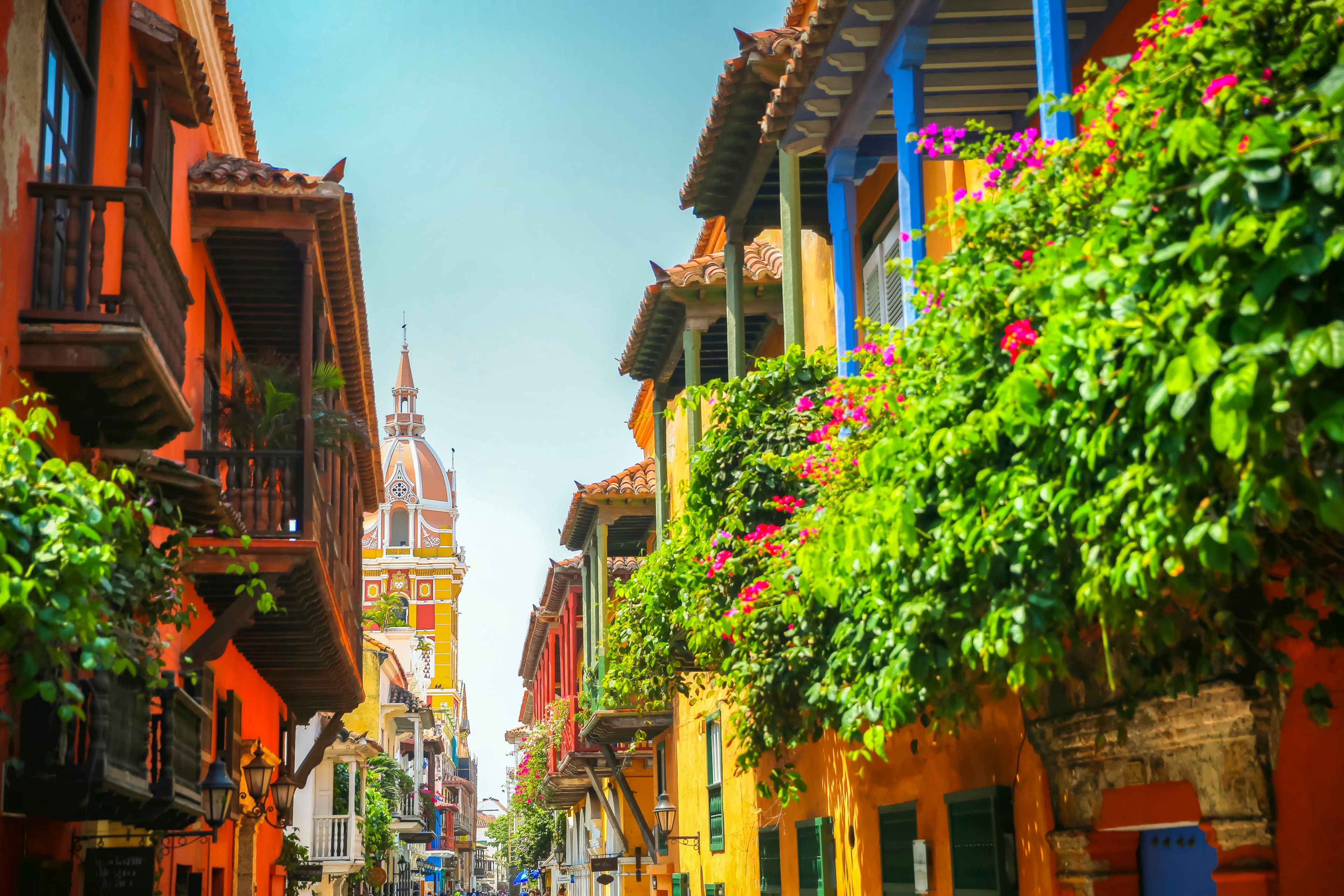 Lush balcony planters along the street looking toward town square in the old town of Cartagena/Getty Images