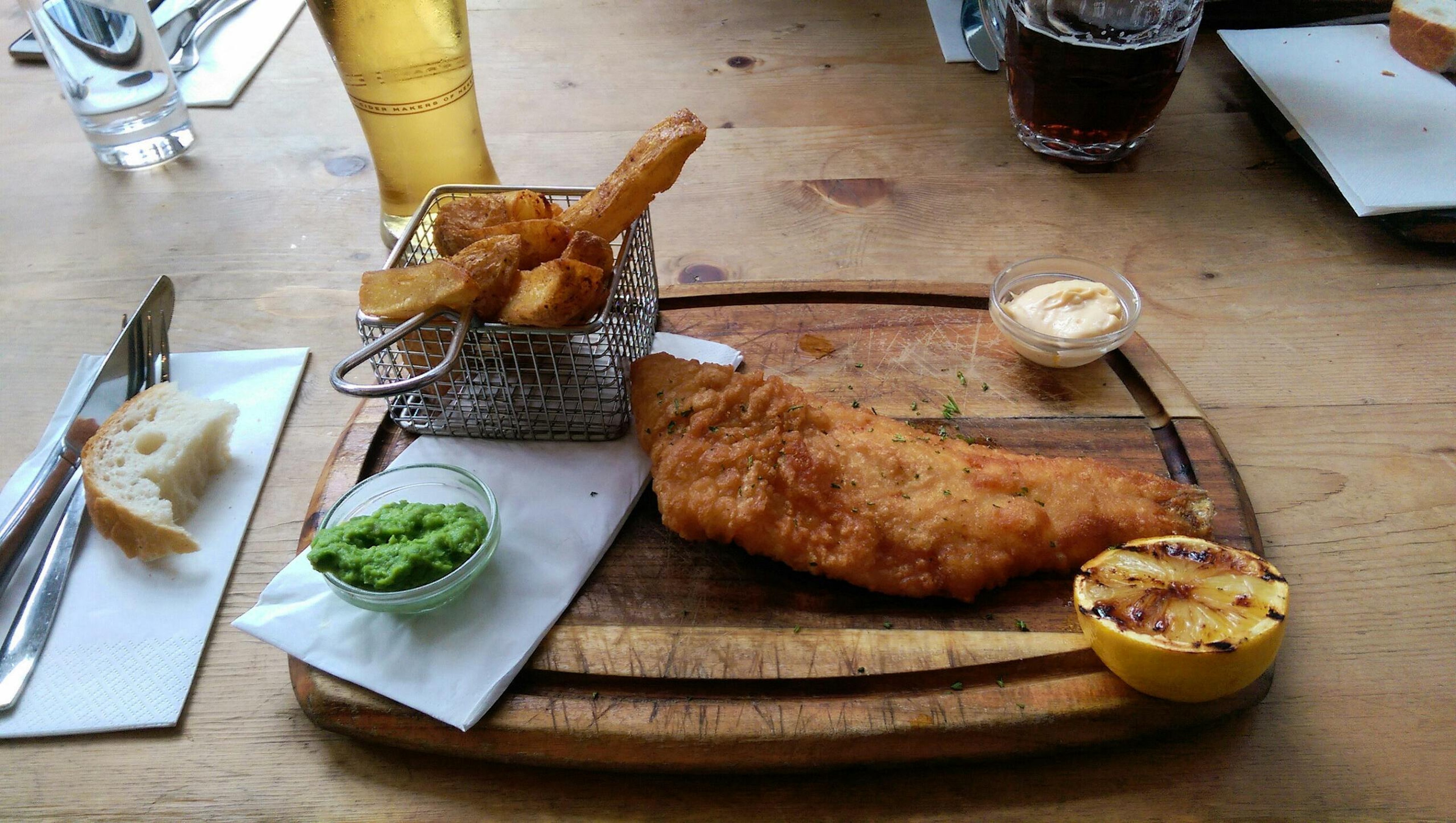 Who can resist fish and chips in a London pub, especially if served with a side of televised rugby?/Getty Images