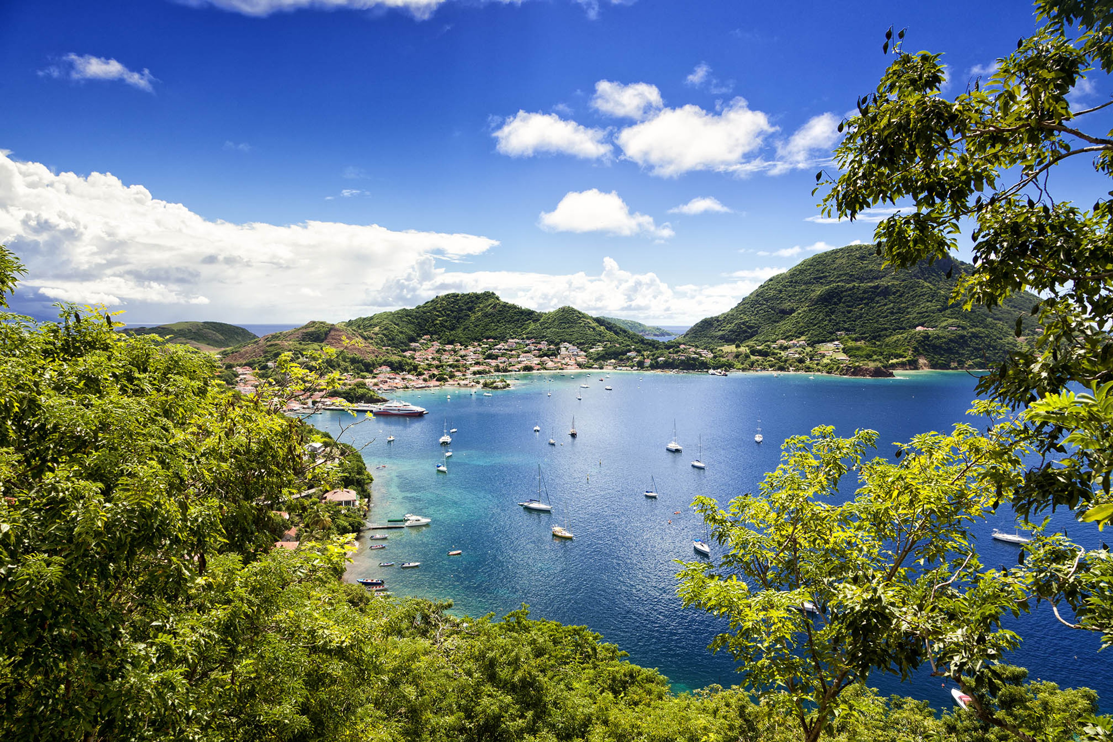Town and bay of Terre-de-Haut, capital of Les Saintes islands, Guadeloupe archipelago, Caribbean Sea./ Shutterstock