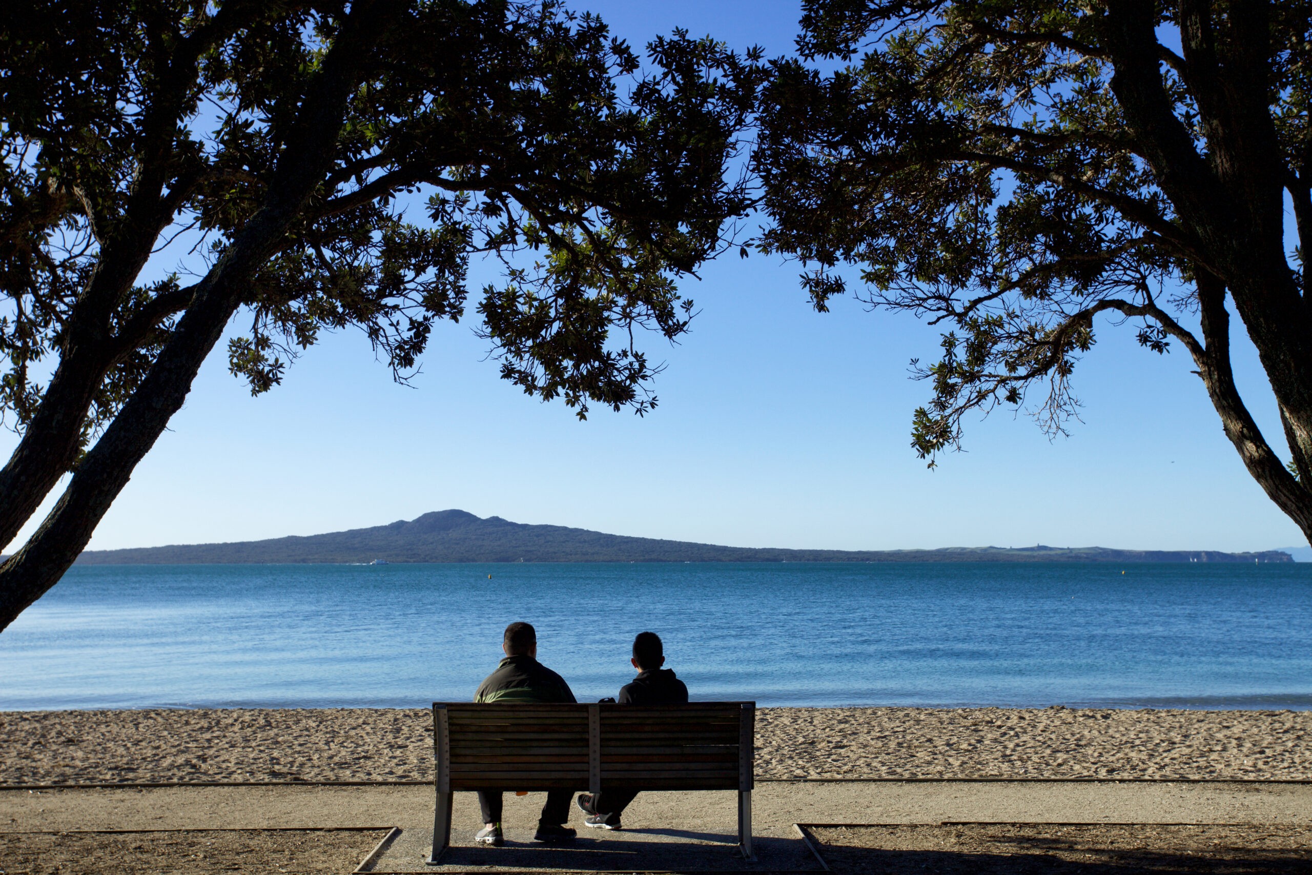 Looking across Mission Bay toward Rangitoto volcano in New Zealand, which erupted about 600 years ago./Getty Images