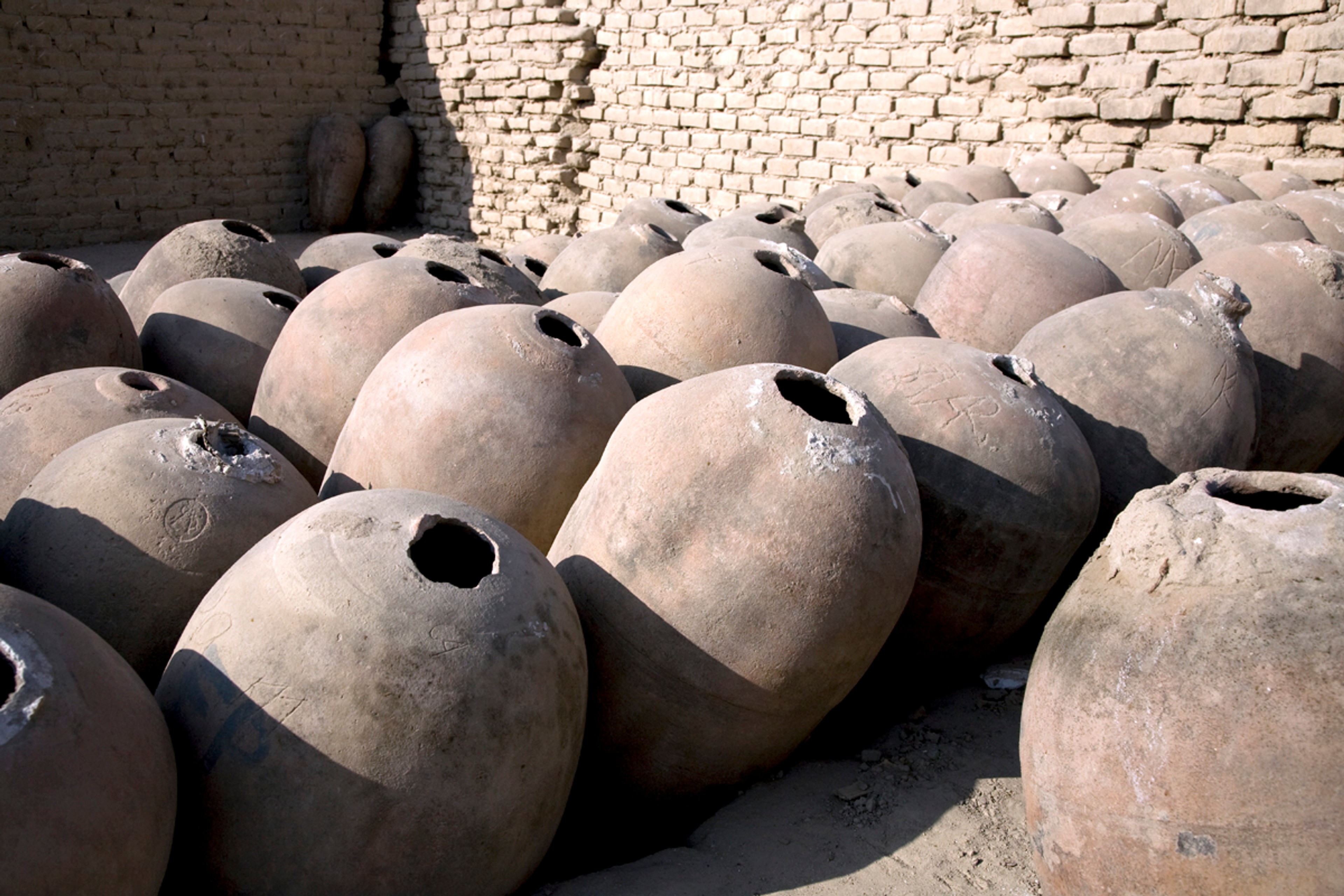 Botijas, or clay jars, were once used to store fermenting pisco./Shutterstock