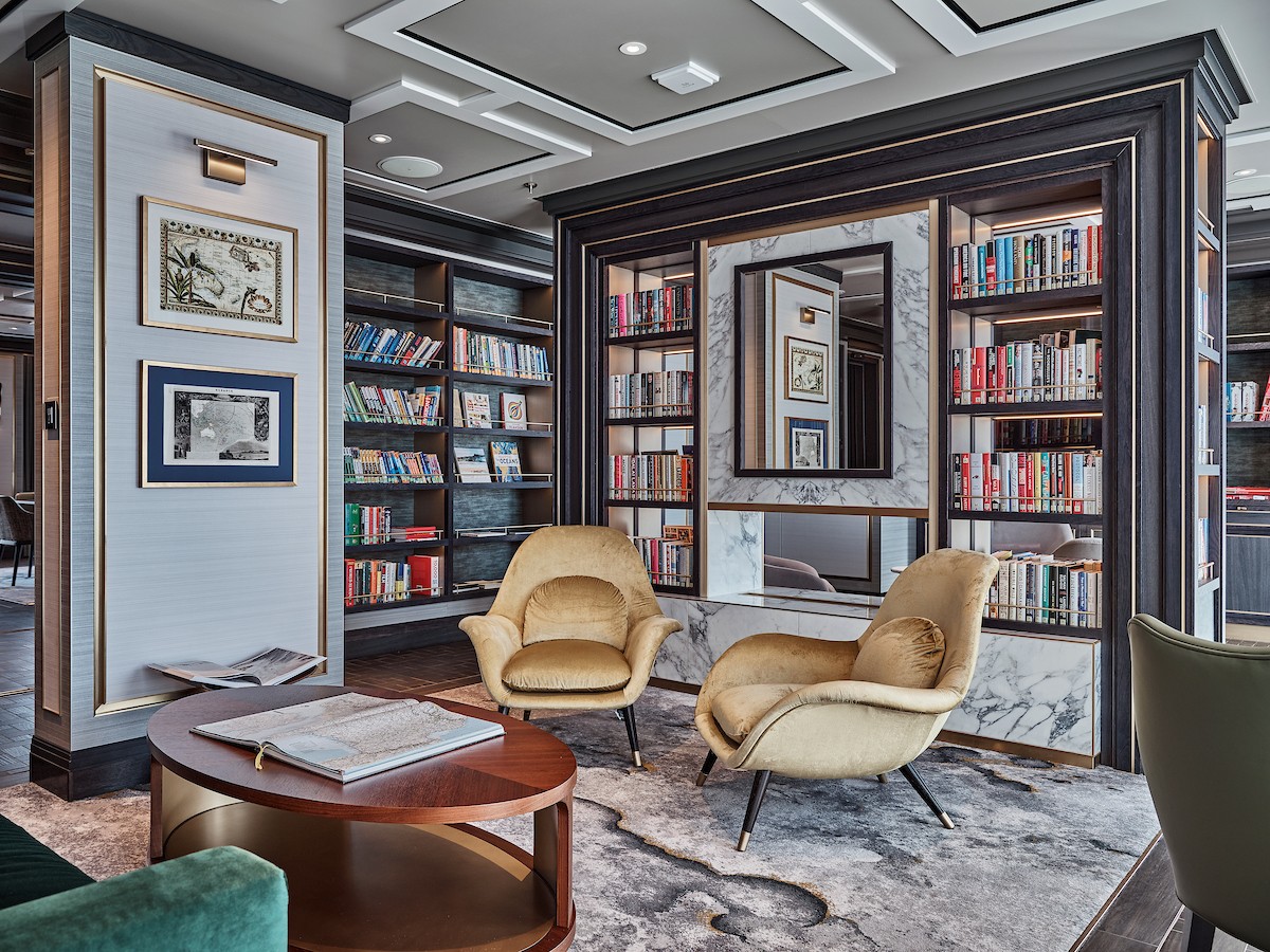 The library on the Silver Endeavour offers plenty of reading material for guests./Silversea