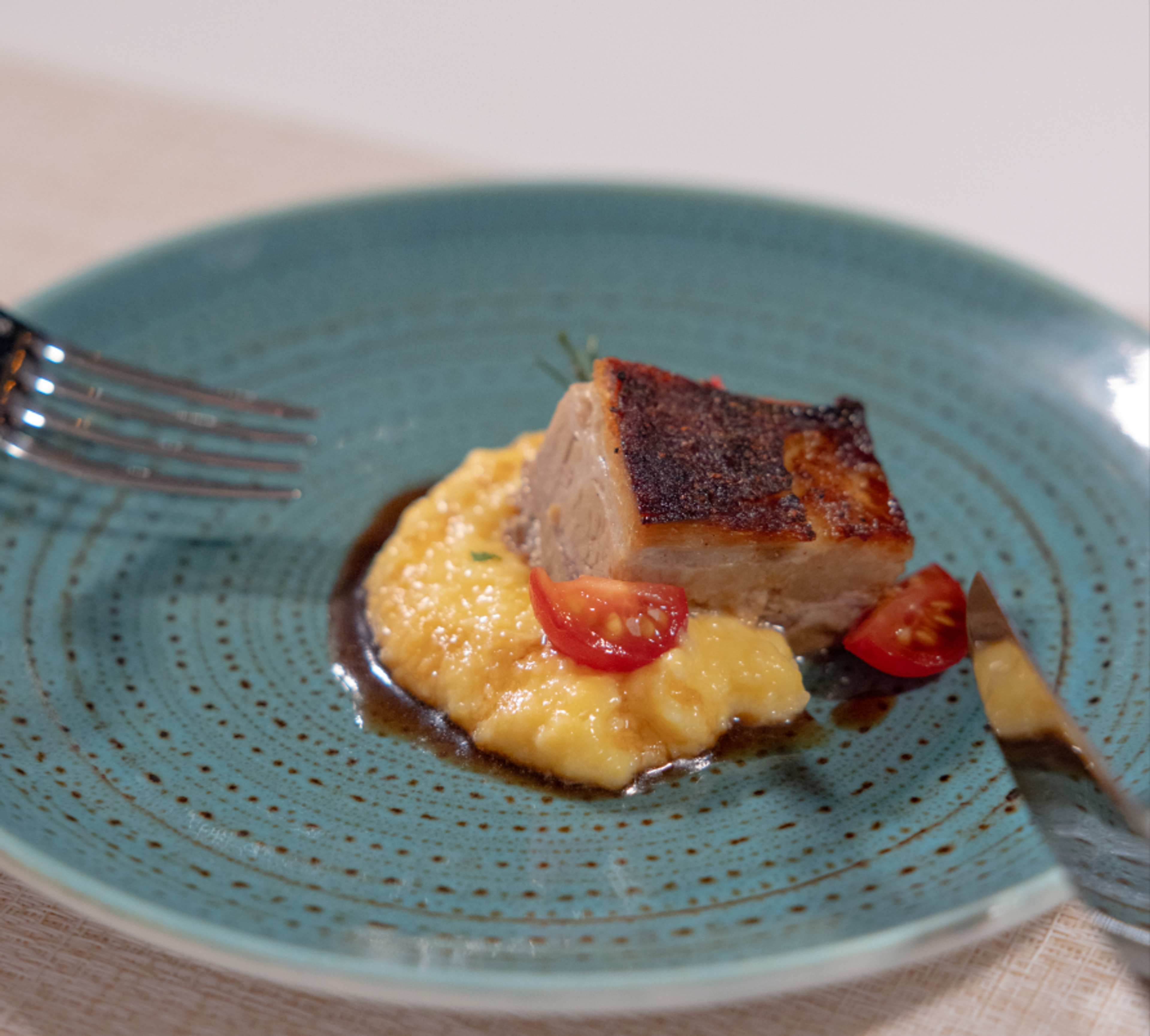 In the Galapagos, pork belly and polenta is a favorite locally-inspired dish for Gabriela Naranjo, Silversea's Ecuadorian-based executive./Silversea