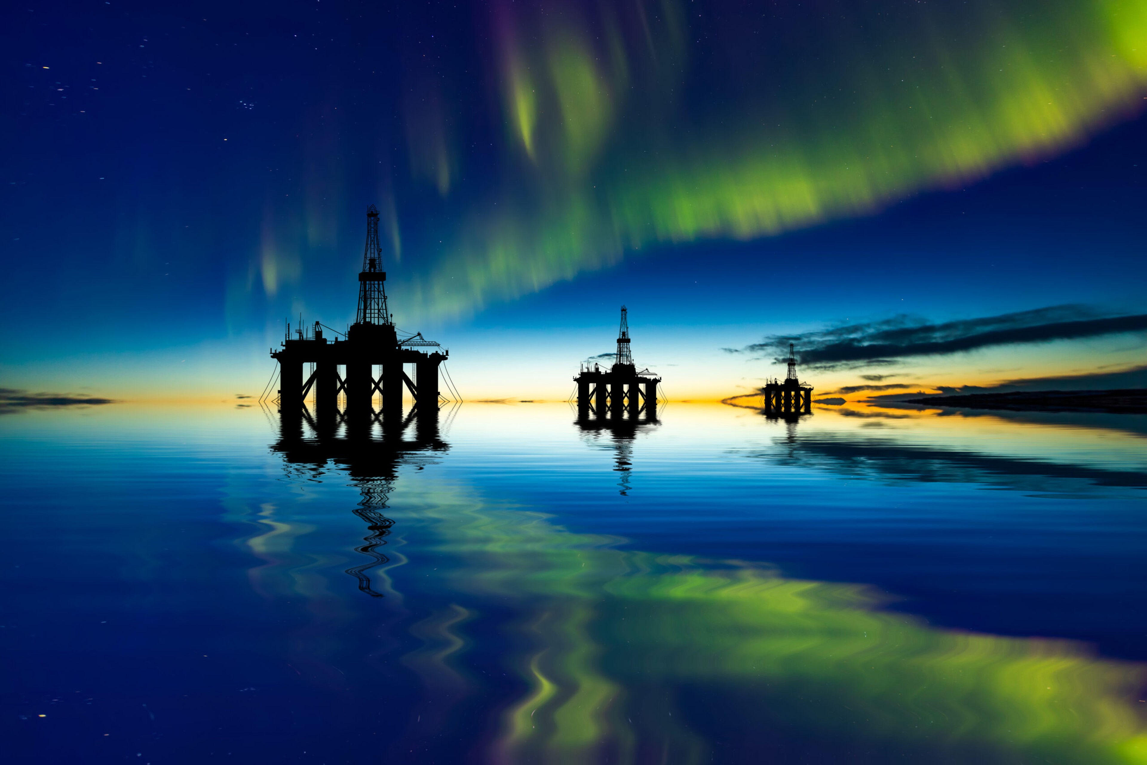 The Northern Lights illuminate oil platforms in Norway's north./Getty Images