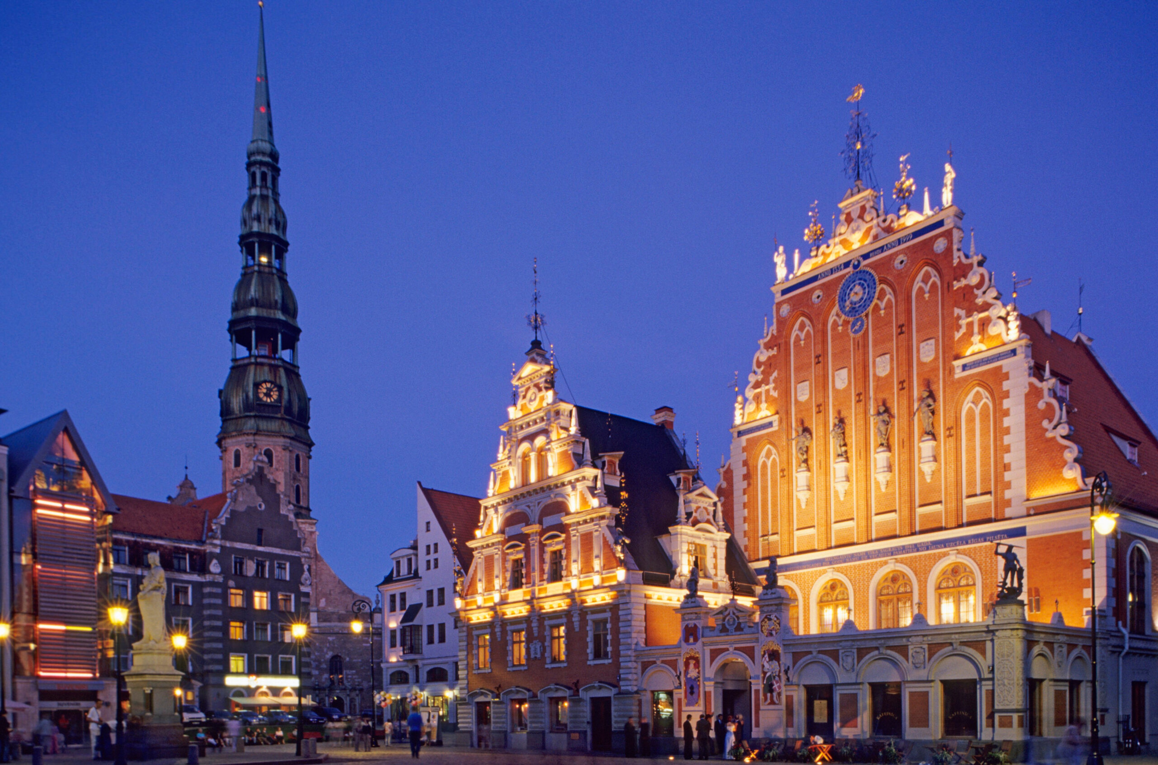 In Riga, Latvia, the 400-foot-tower (left) of St. Peter's church and the Schwarzhaupter Haus (right), which dates to the 1300s/Getty Images