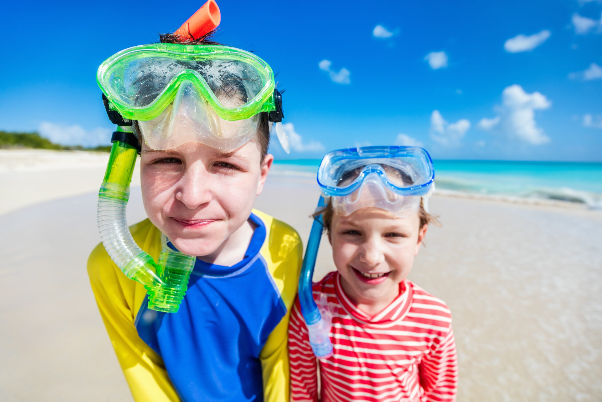 Rash guards are imperative, especially for kids, for sun protection along with sunscreen./Shutterstock