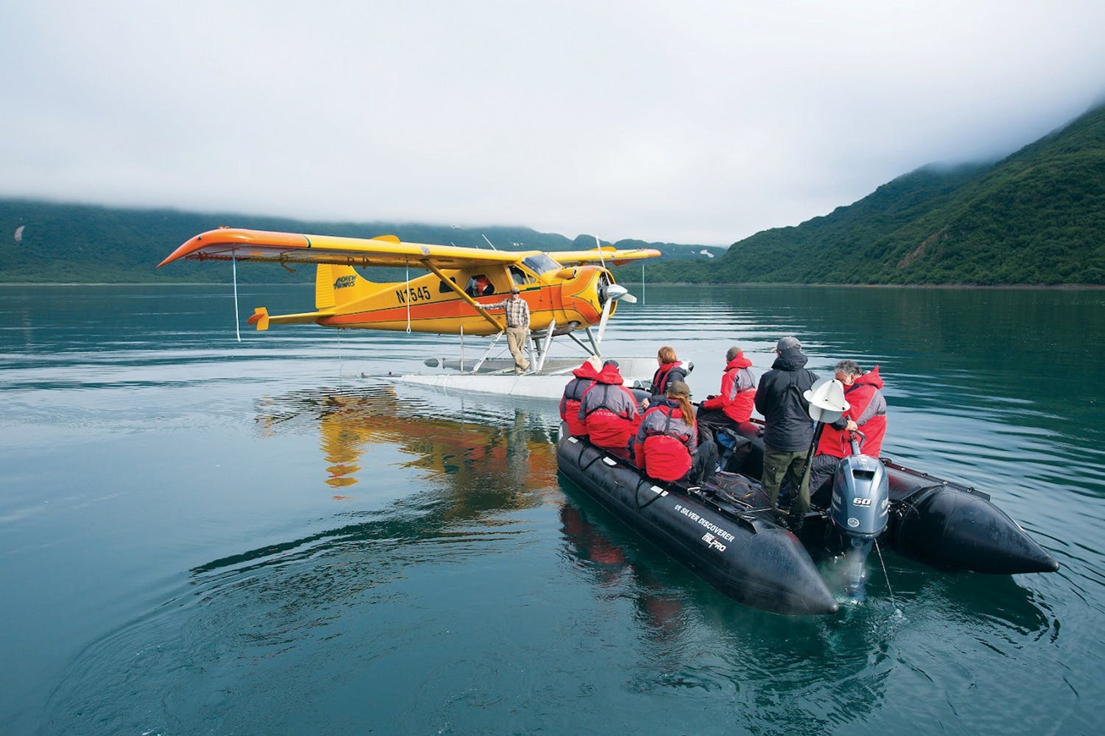 Silversea's guests approach a floatplane by Zodiac in Geographic Harbor in the Katmai National Park, Alaska/Richard Sidey