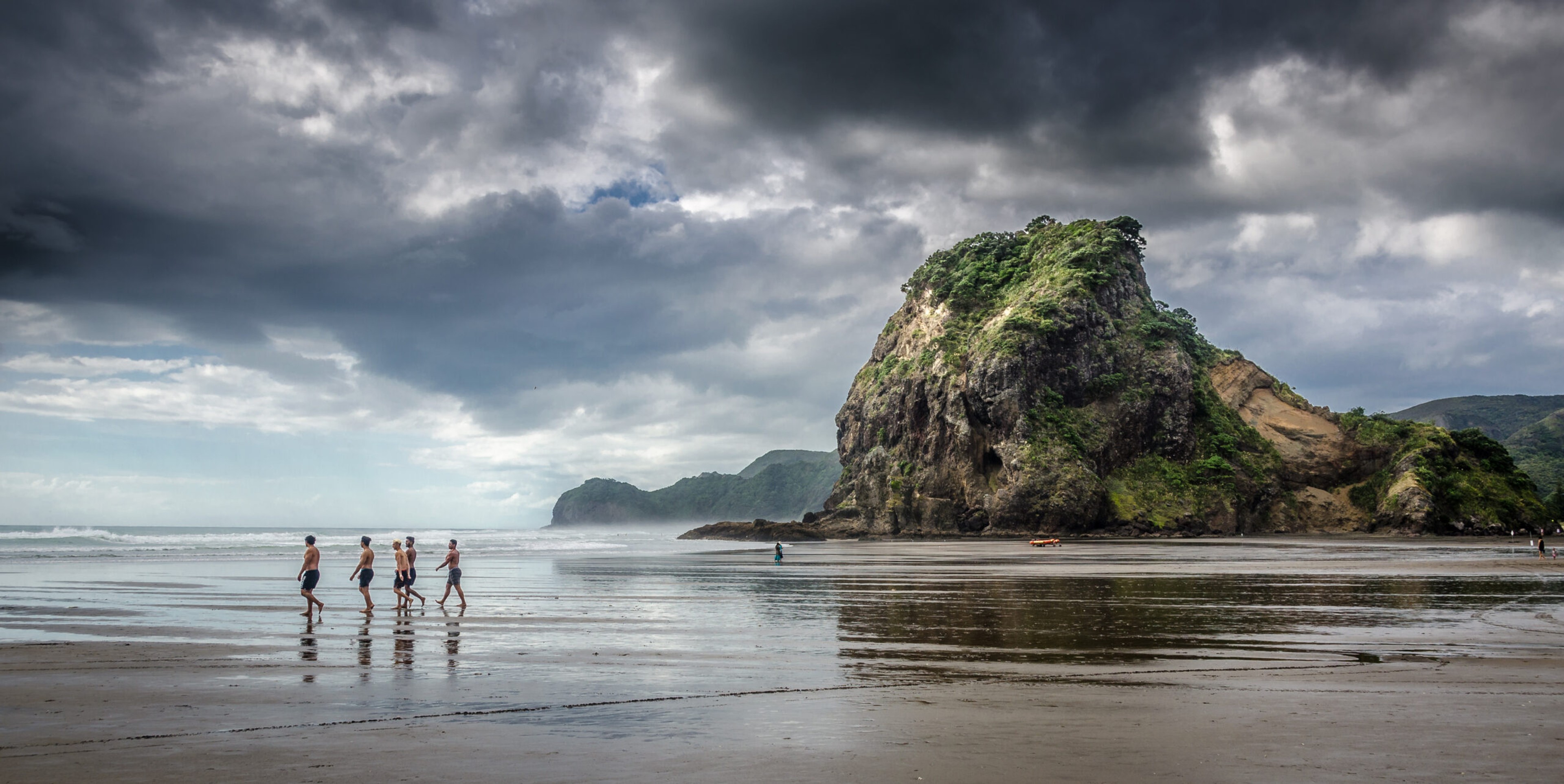 Lion Rock and Piha Beach, about 45 minutes west of Auckland/Getty Images