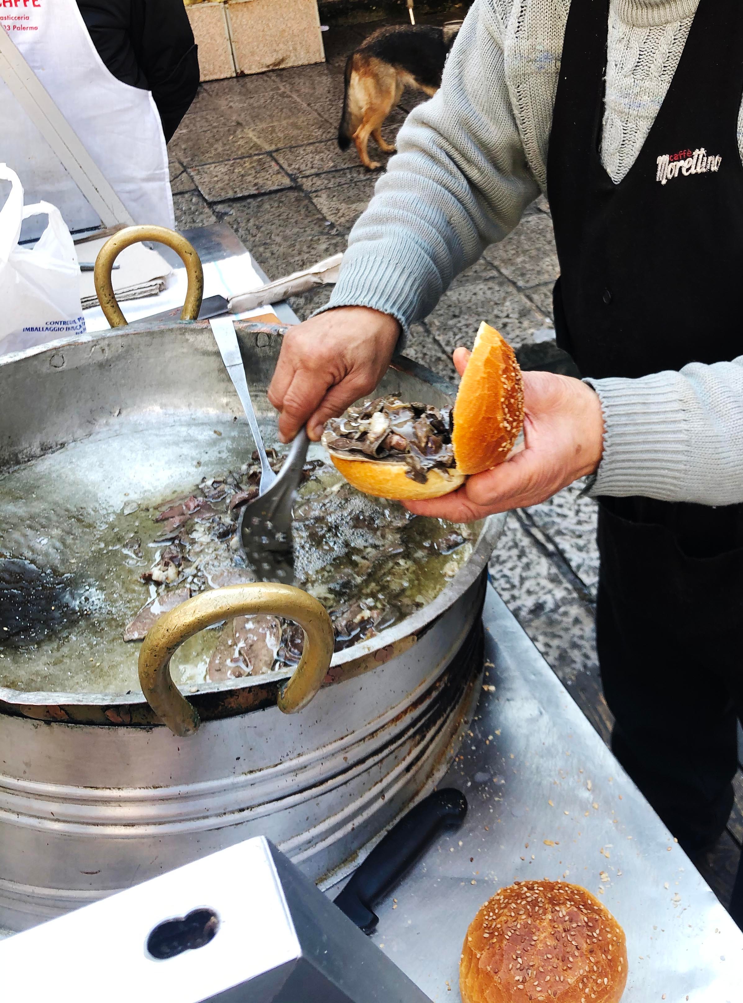 Preparing pane con la milza in a traditional market in Palermo, Sicily/Howie Kahn